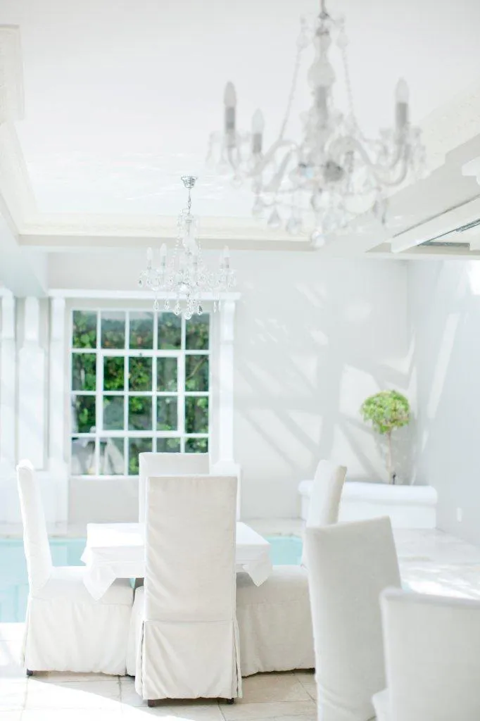 Poolside dining with crystal chandeliers