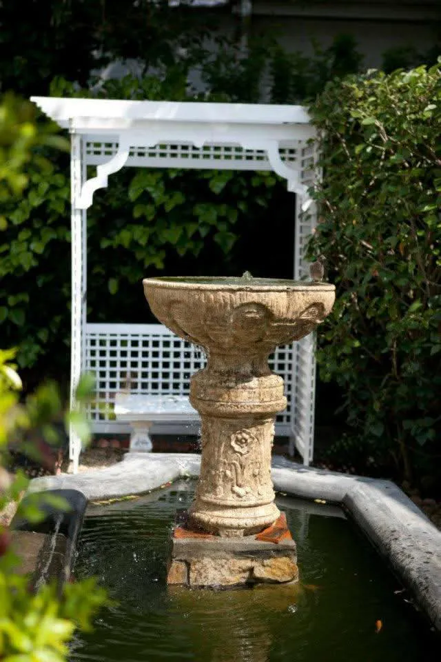 Garden fountain and arbor at Banksia Boutique Spa