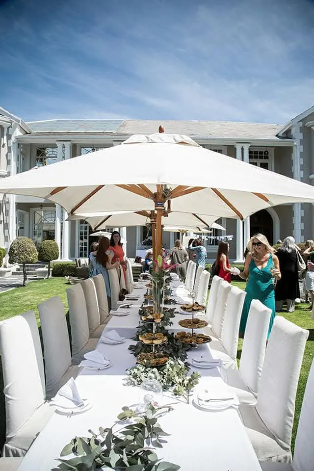 Long banquet table on the lawn at Banksia Boutique