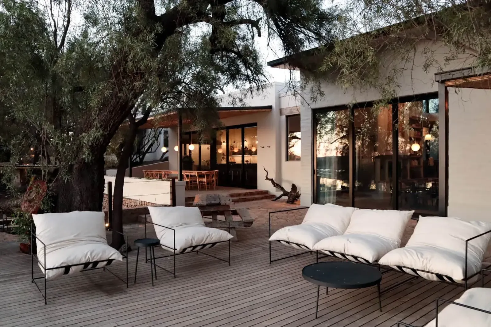 Outdoor lounge seating on The River House deck