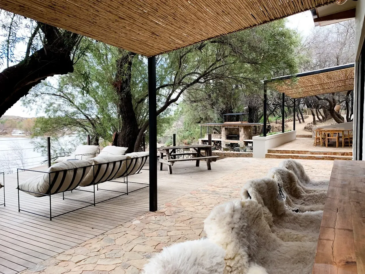 Covered deck seating beside the Orange River