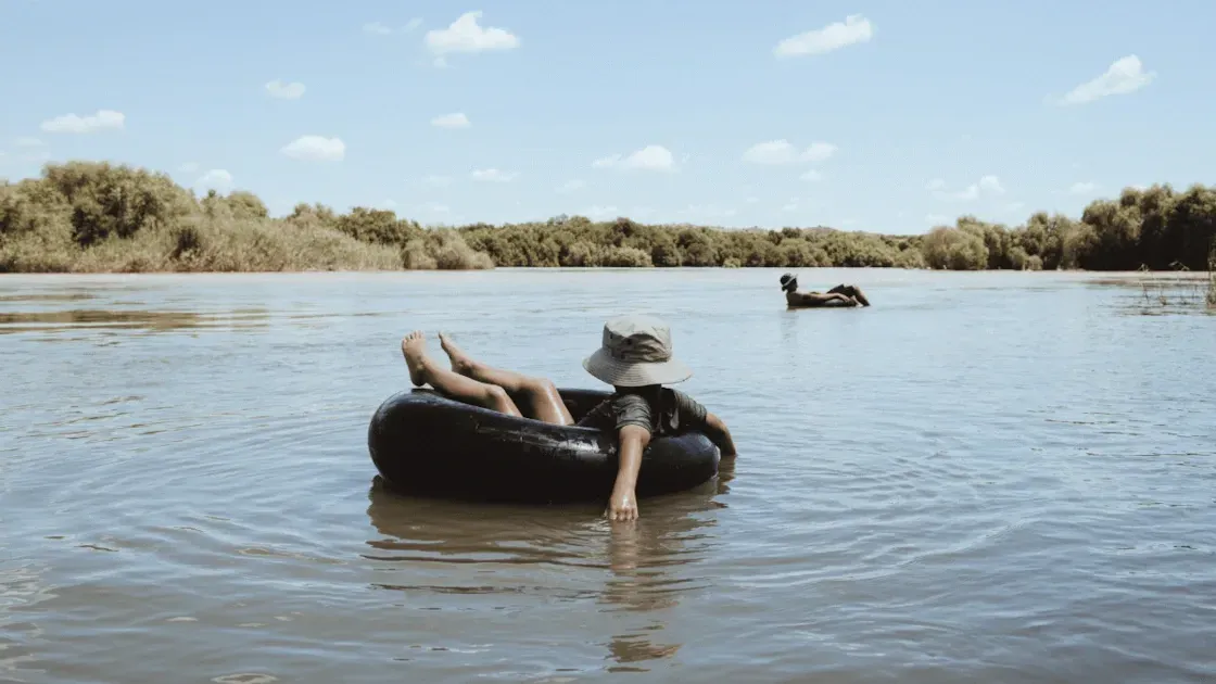 A guest relaxing on the Orange River