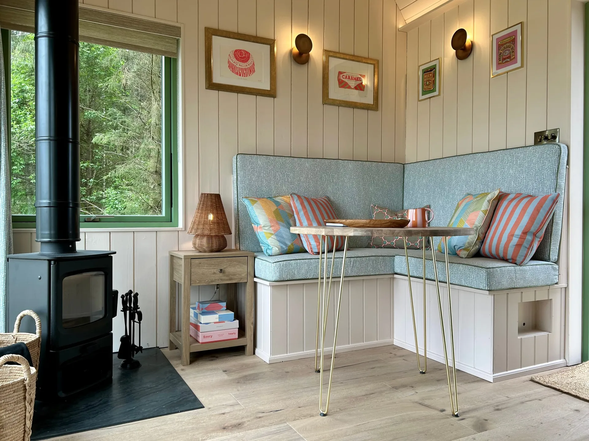 Fairlight's dining nook with a log burner and banquette