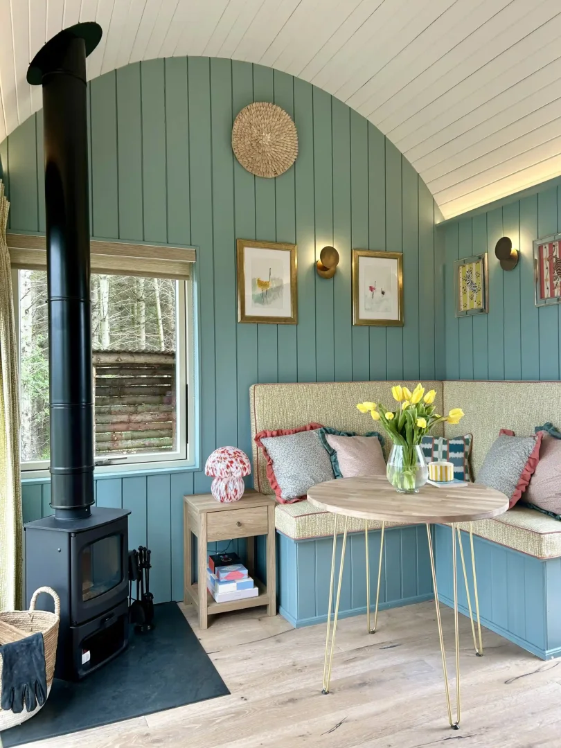 Milkwood's dining nook beside the log burner