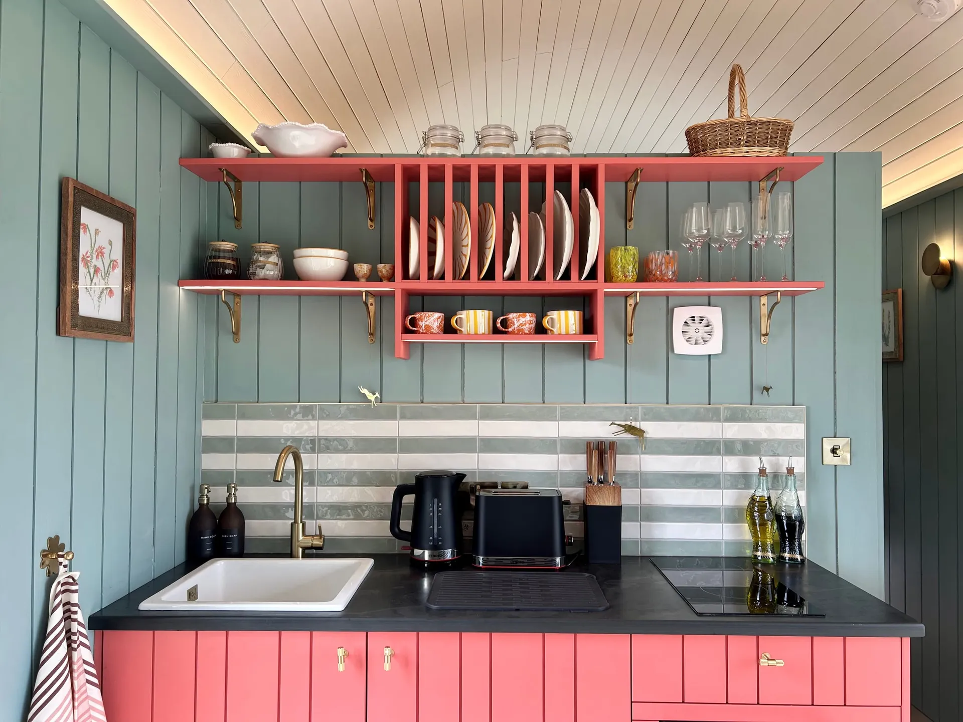 Milkwood's pink kitchen and open shelves