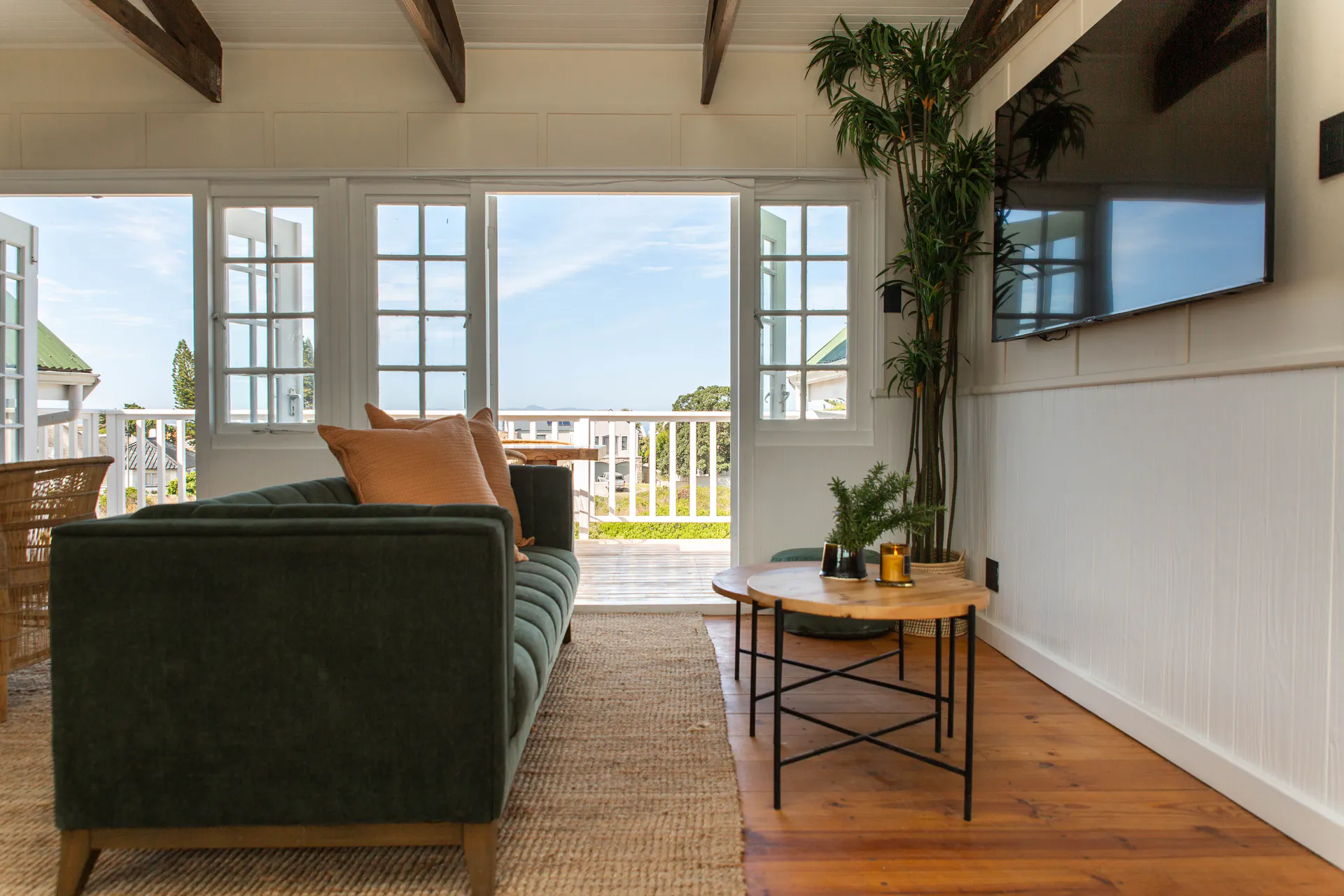 Sea Facing Apartment living room looking out to the balcony and sea