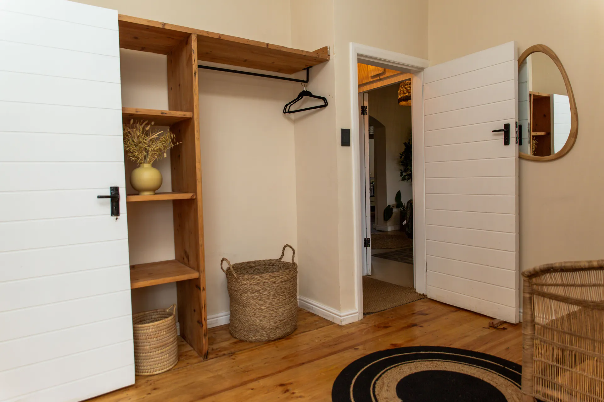 Open wardrobe and hanging rail in the Ground Floor Apartment