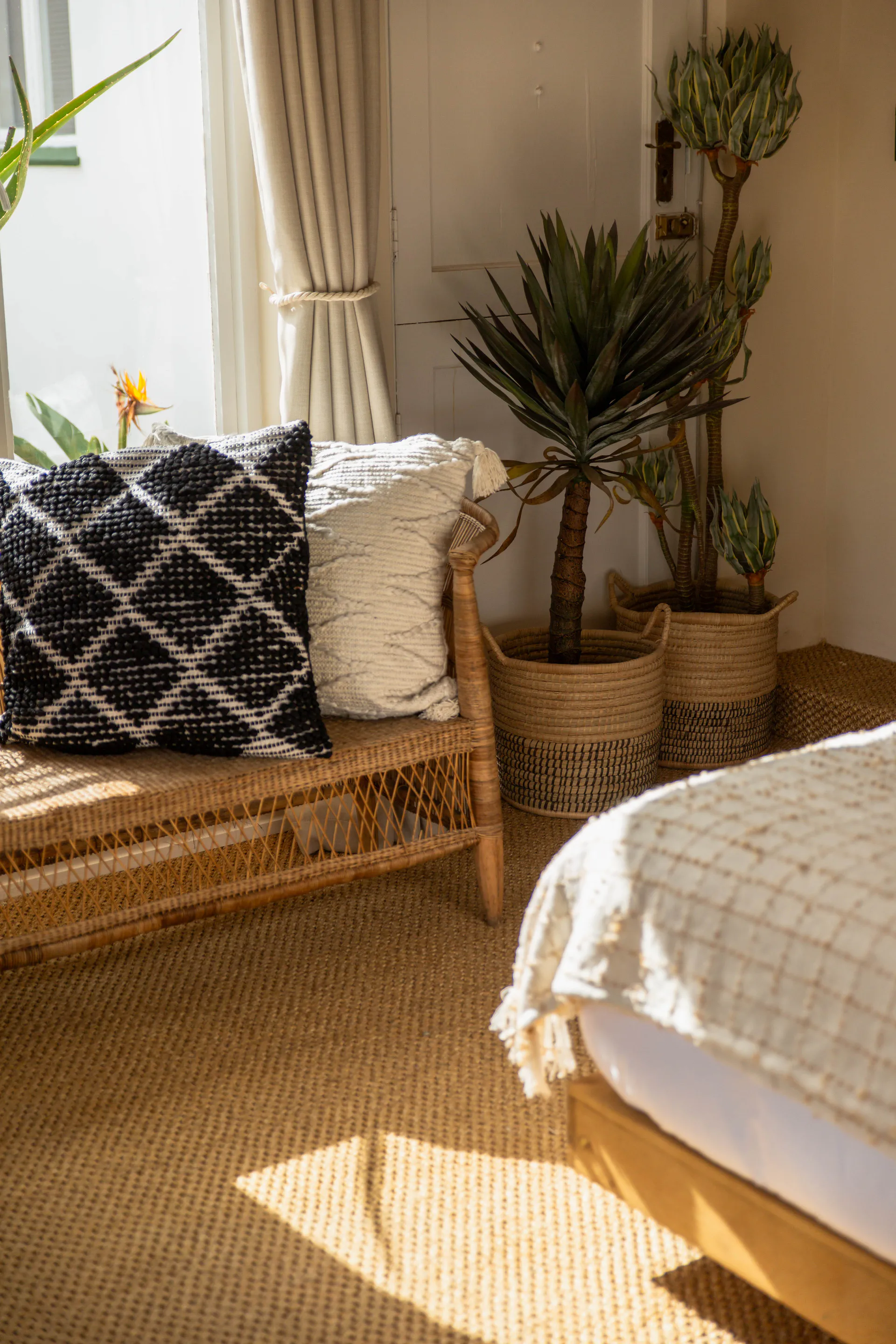 Rattan bench and indoor plants in the Standard Garden Room