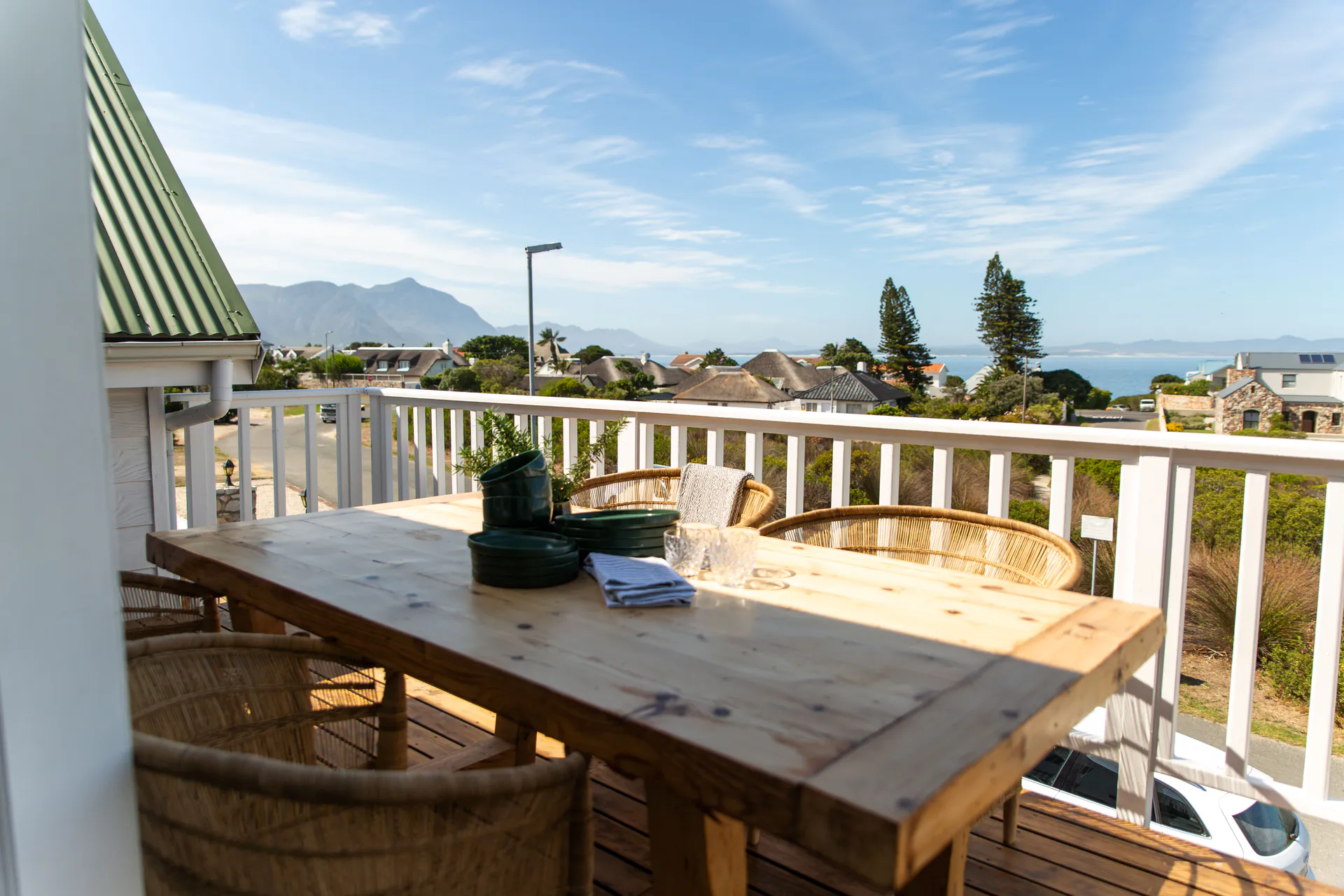 Sea Facing Apartment balcony dining with a view of town and sea