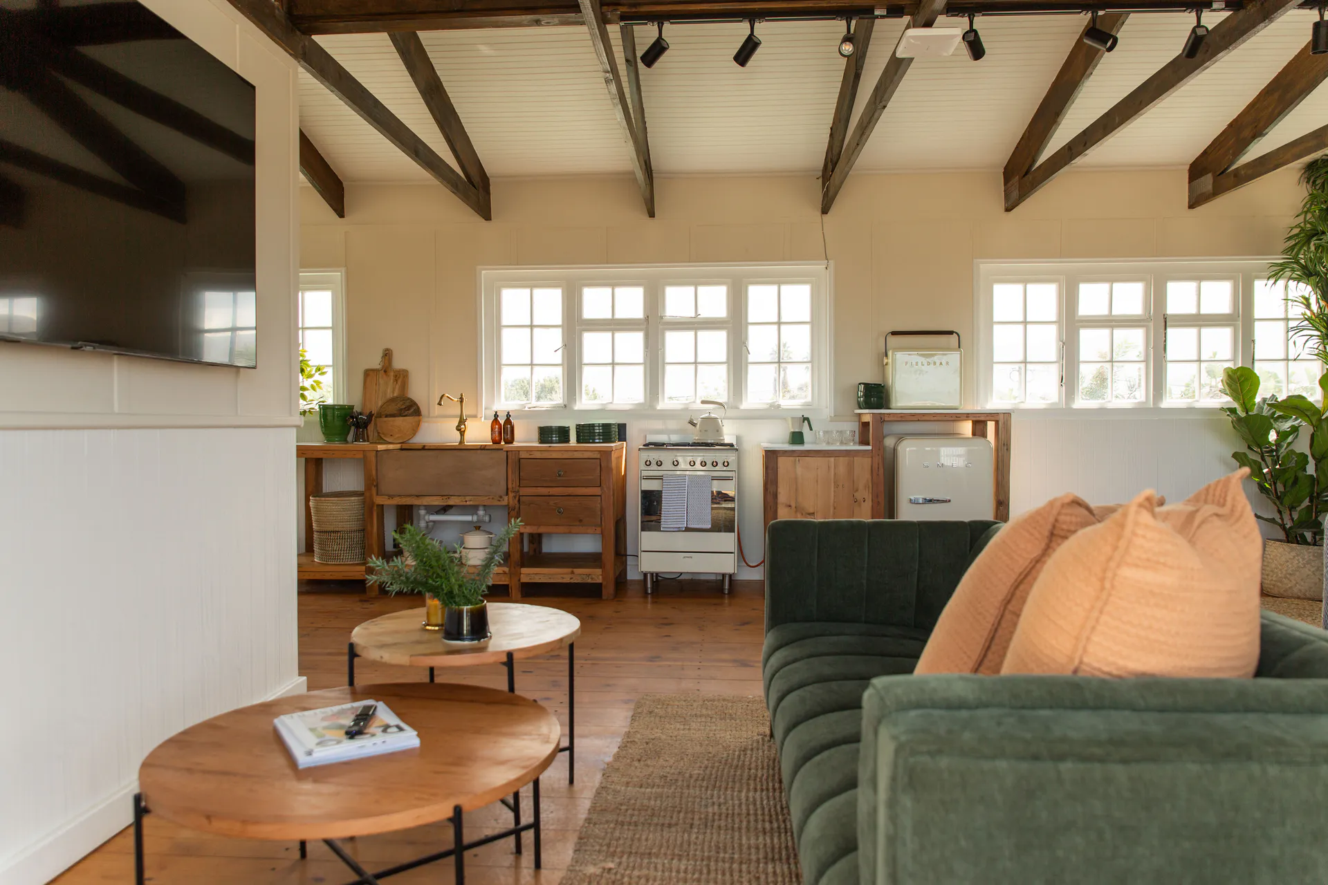 Sea Facing Apartment living room and kitchen under exposed beams