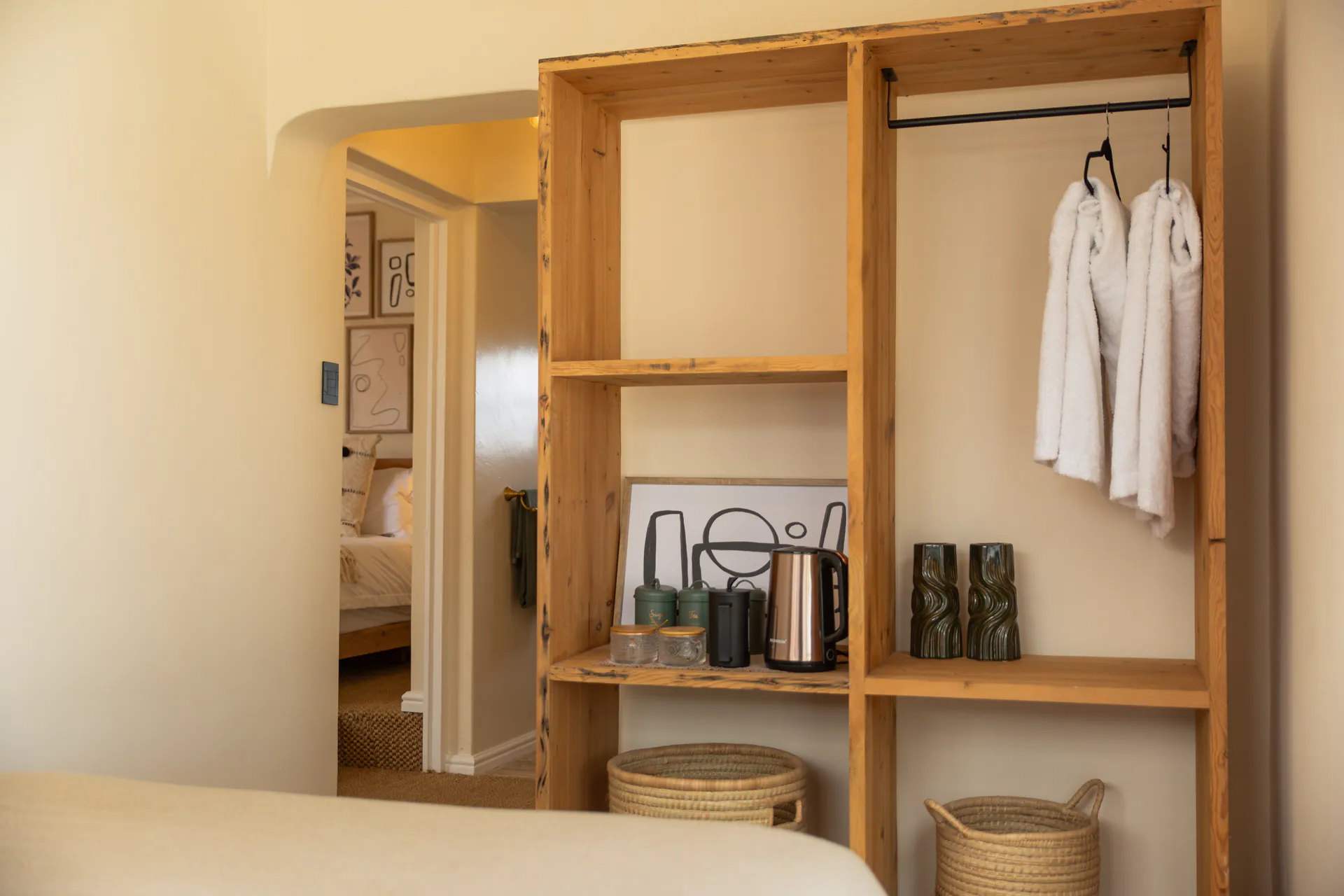 Open wardrobe between the Family Room bedrooms