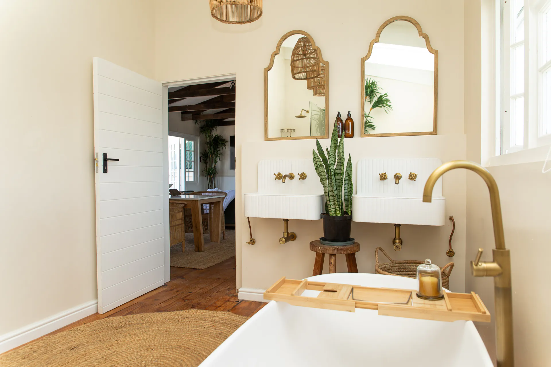 Sea Facing Apartment bathroom with twin basins and arched mirrors