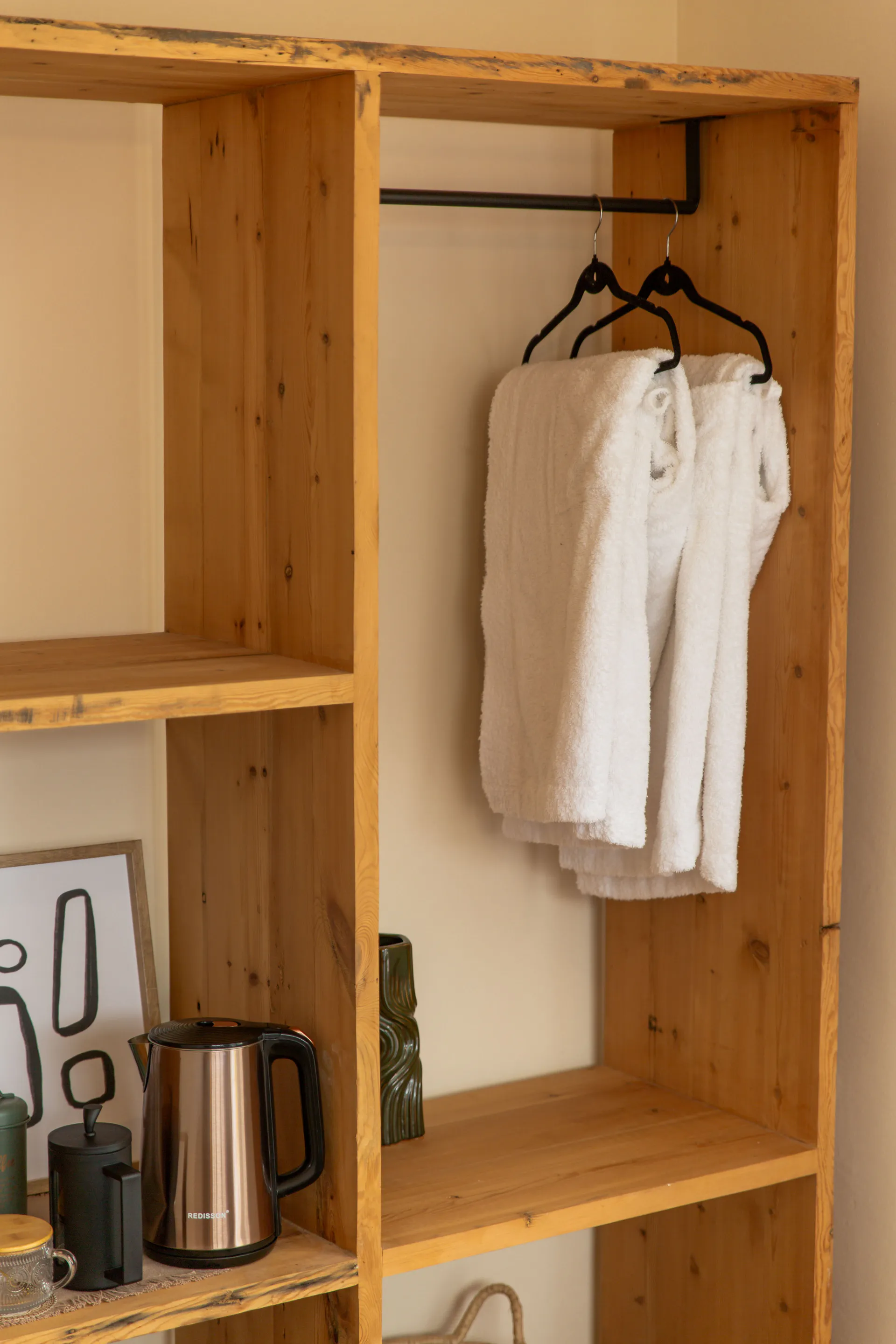 White robes hanging in the Family Room wardrobe