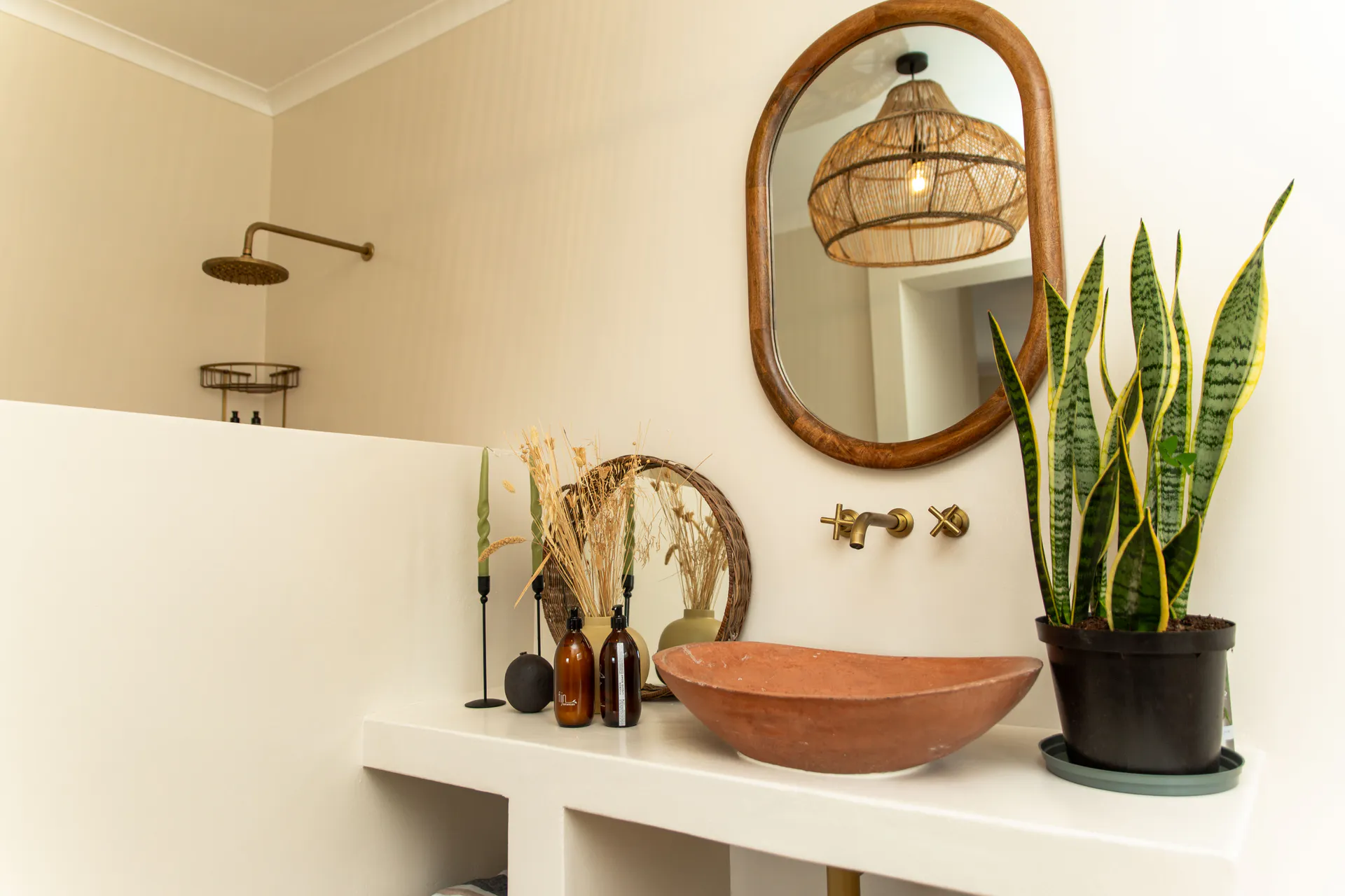 Terracotta vessel sink and brass taps in a Ground Floor Apartment bathroom