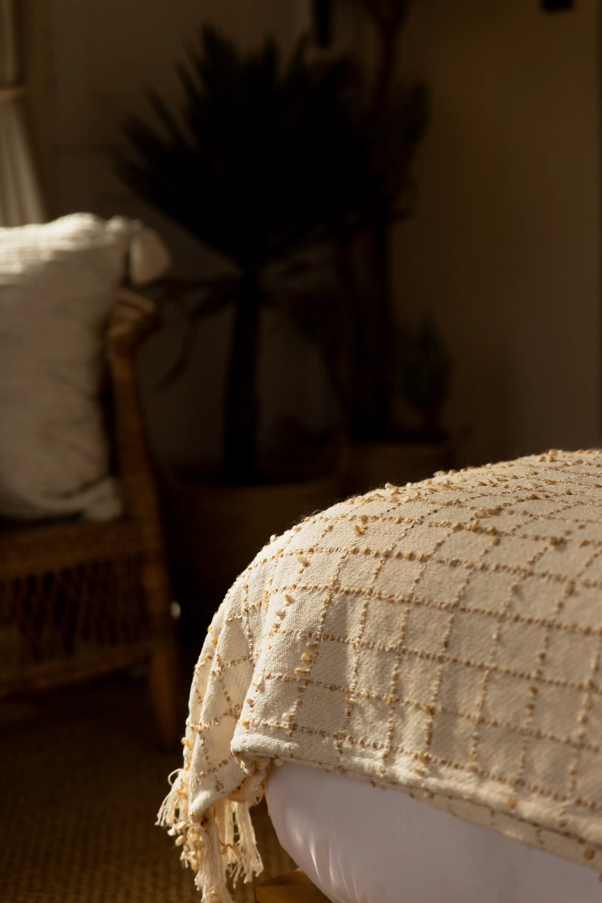 Woven throw at the foot of the Standard Garden Room bed