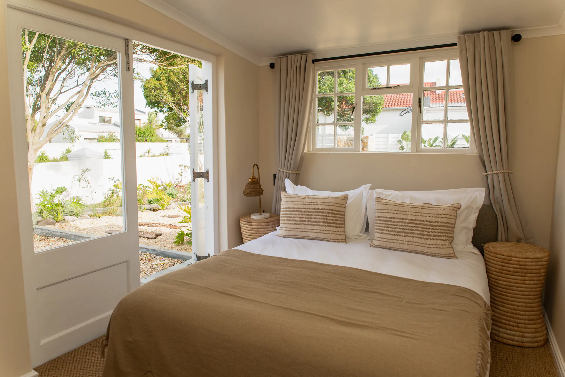 Family Room bedroom with garden doors open