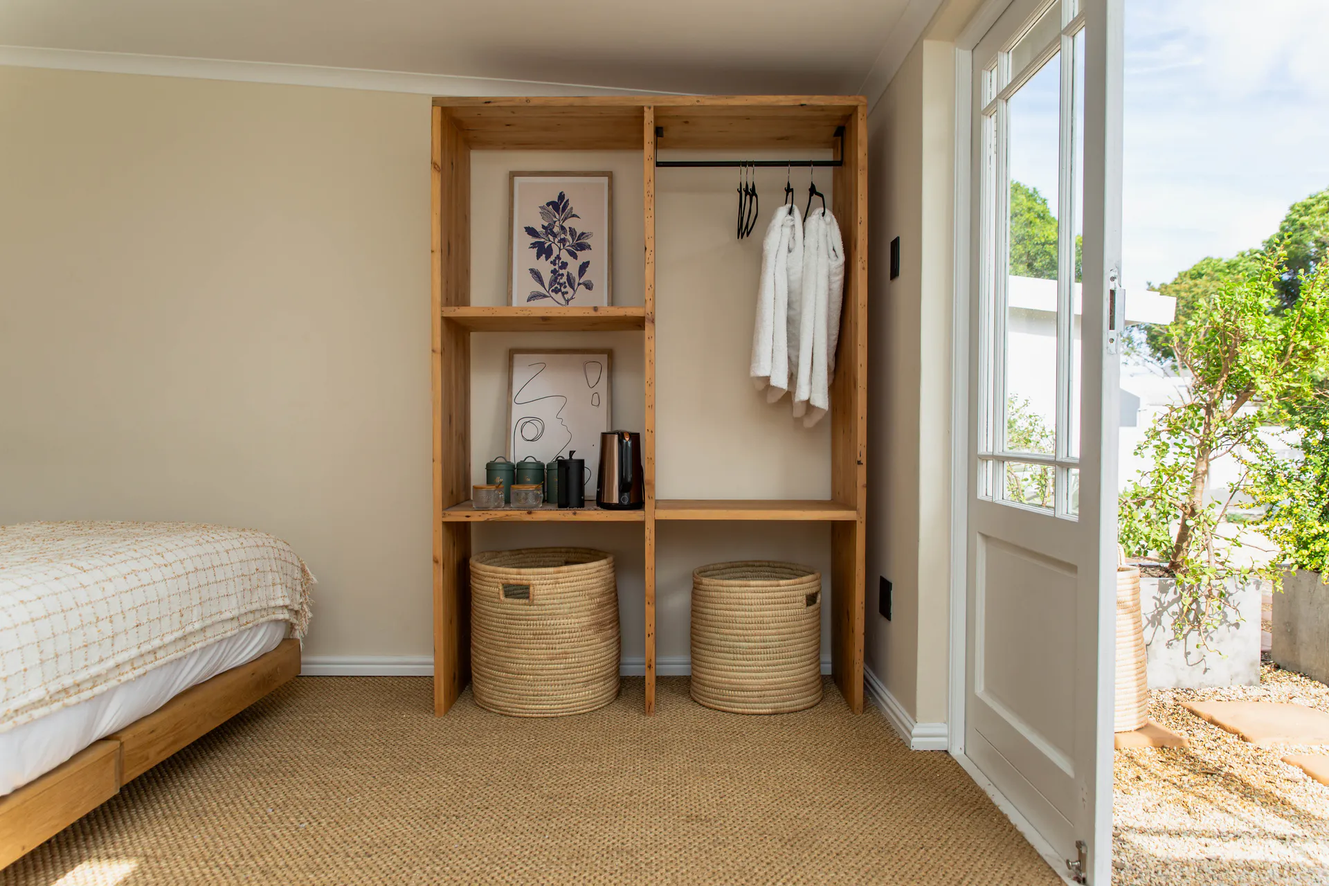 Open wardrobe and garden door in the Standard Garden Room