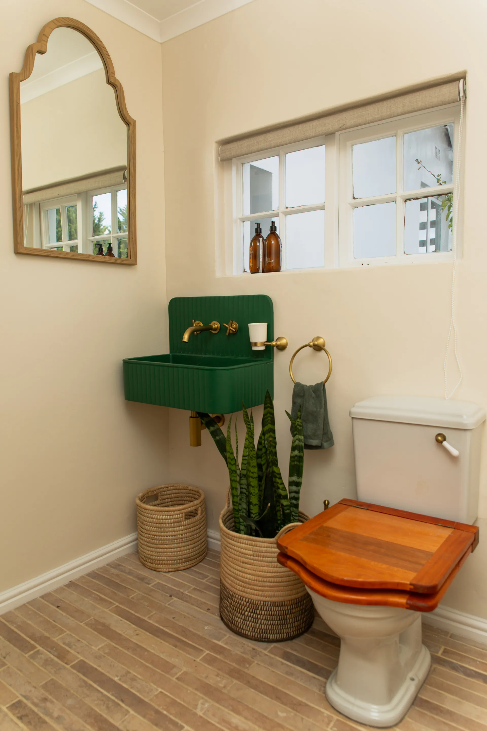 Green fluted basin in the Family Room bathroom