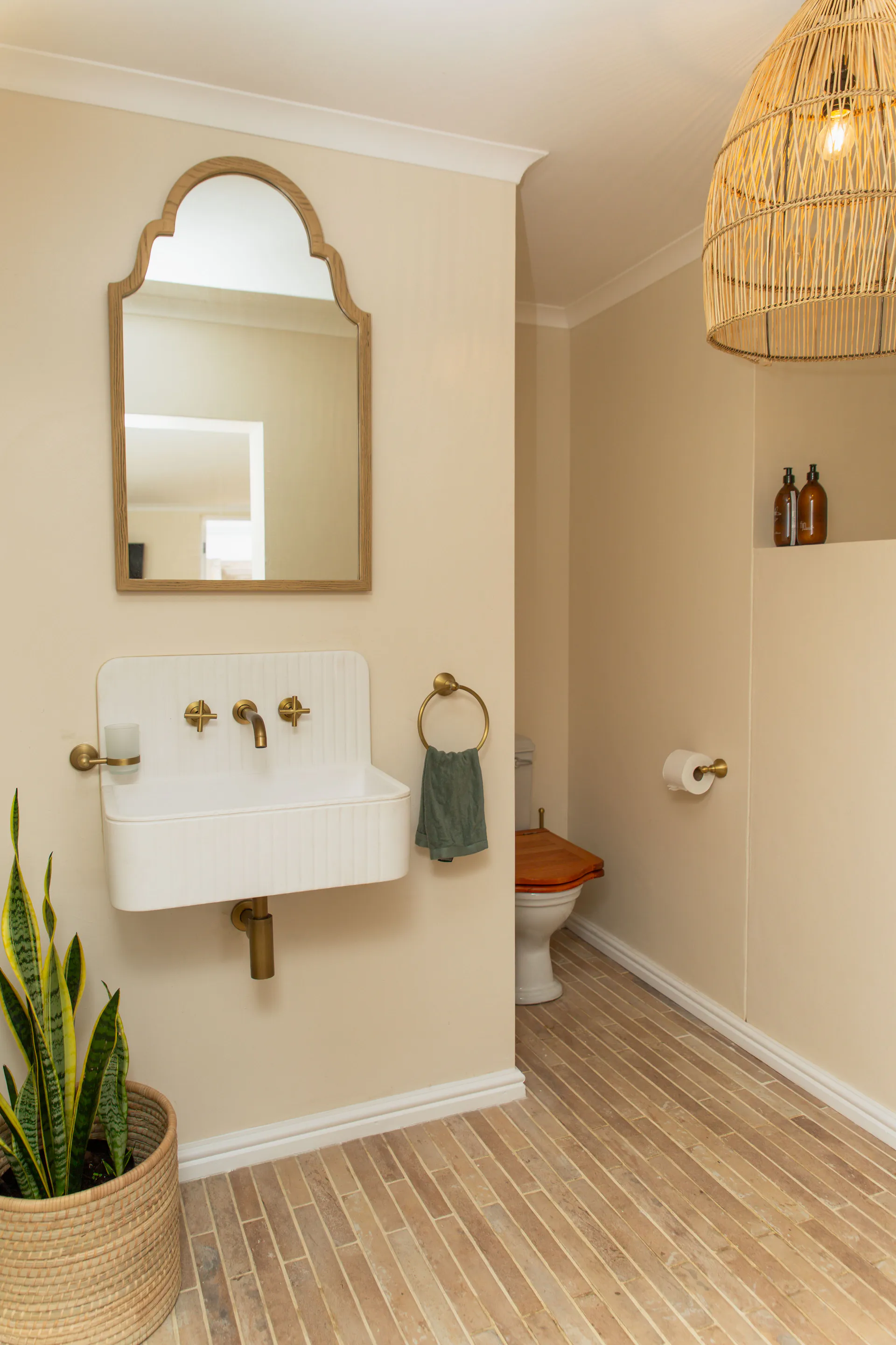 Fluted basin and brass taps in the Standard Garden Room bathroom