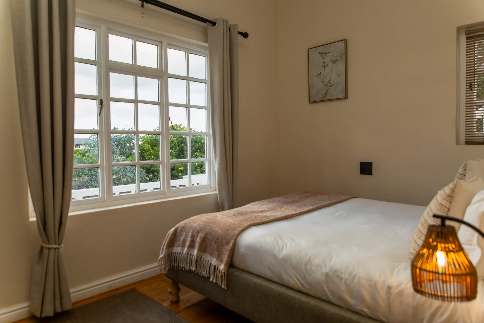 Ground Floor Apartment bed beside the garden window
