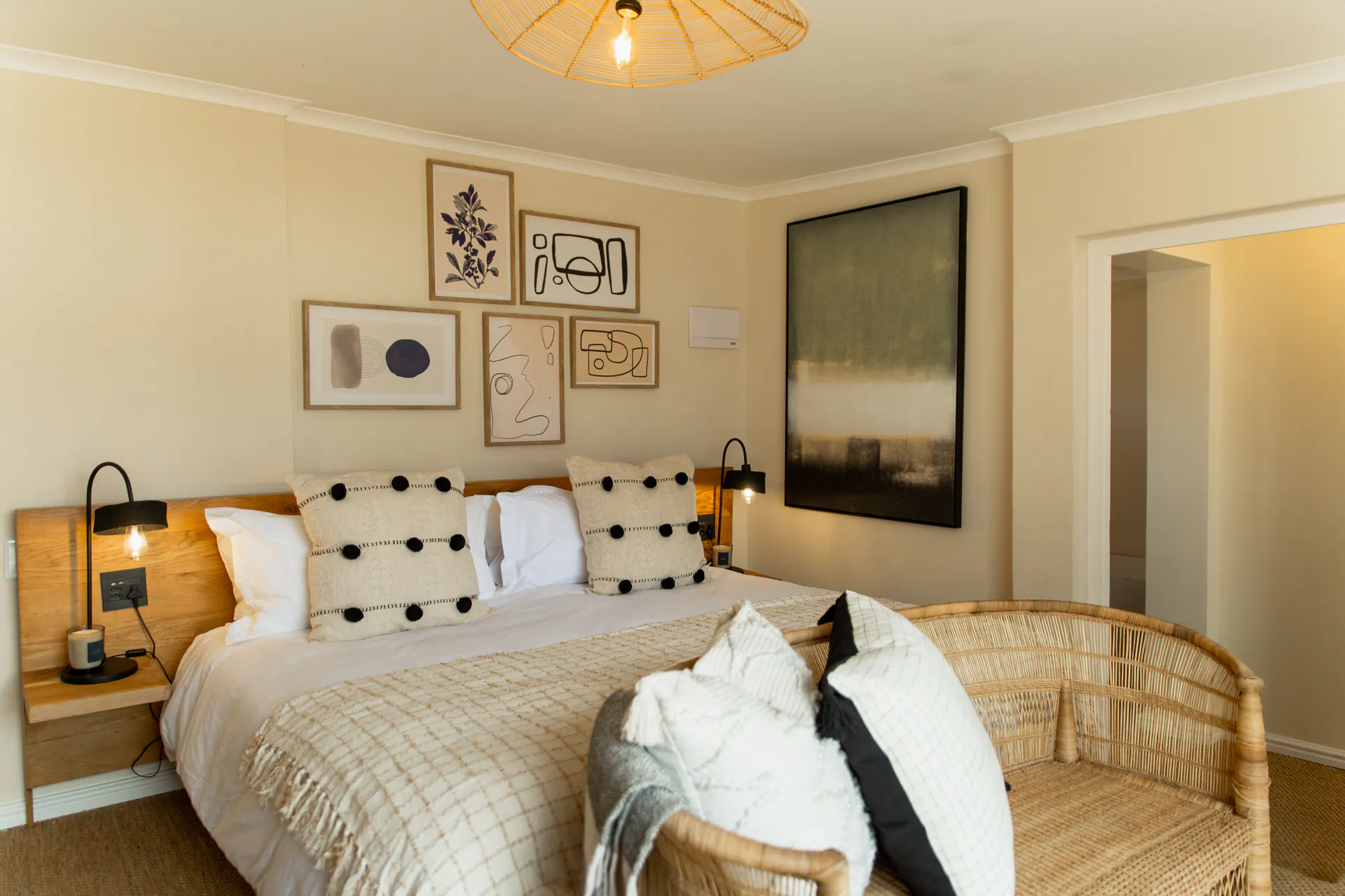 Family Room bed with rattan bench at the foot