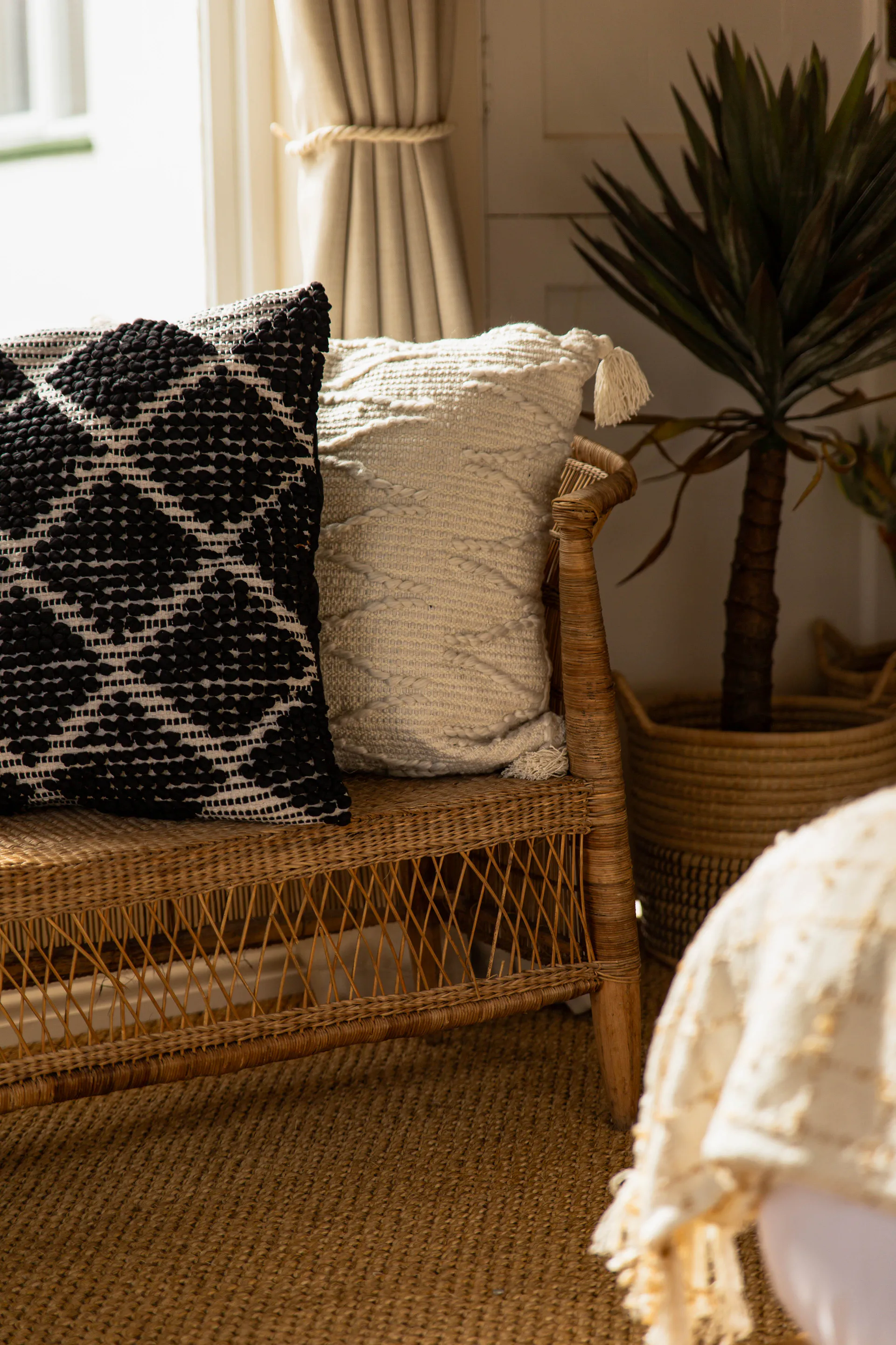 Textured cushions on the rattan bench in the Standard Garden Room