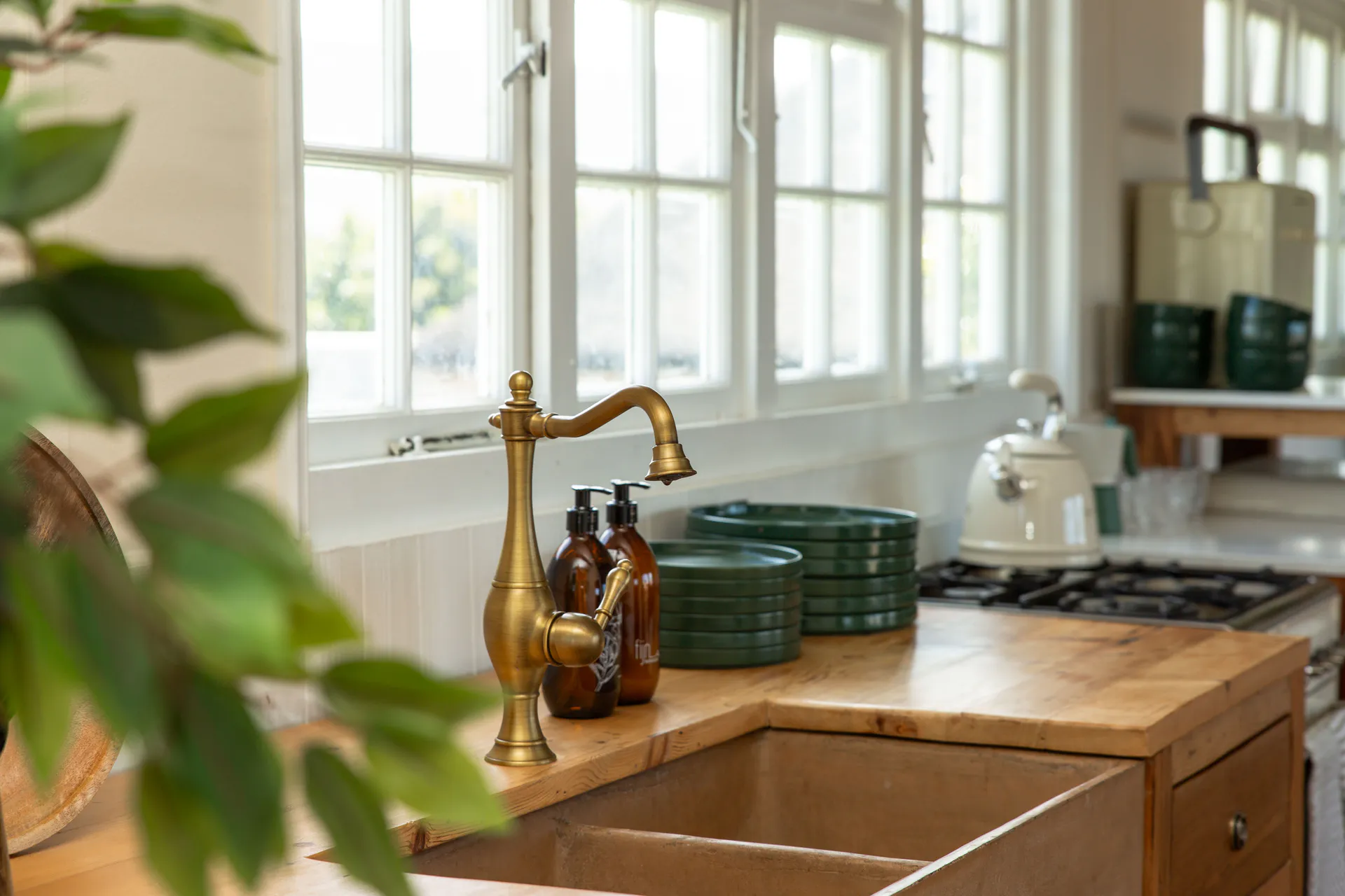 Farmhouse sink and brass tap in the Sea Facing Apartment kitchen