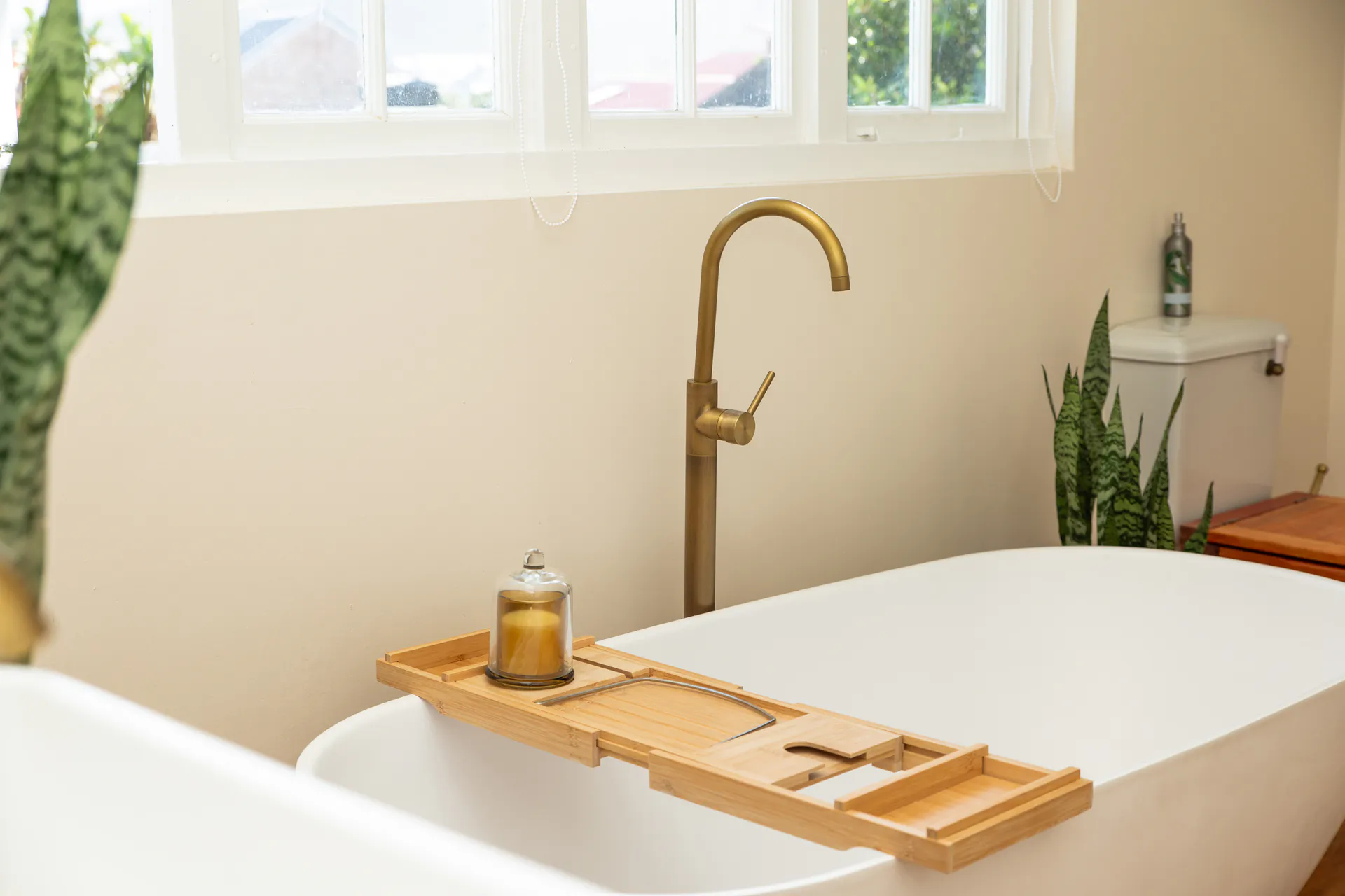 Freestanding bath and brass tap in the Sea Facing Apartment