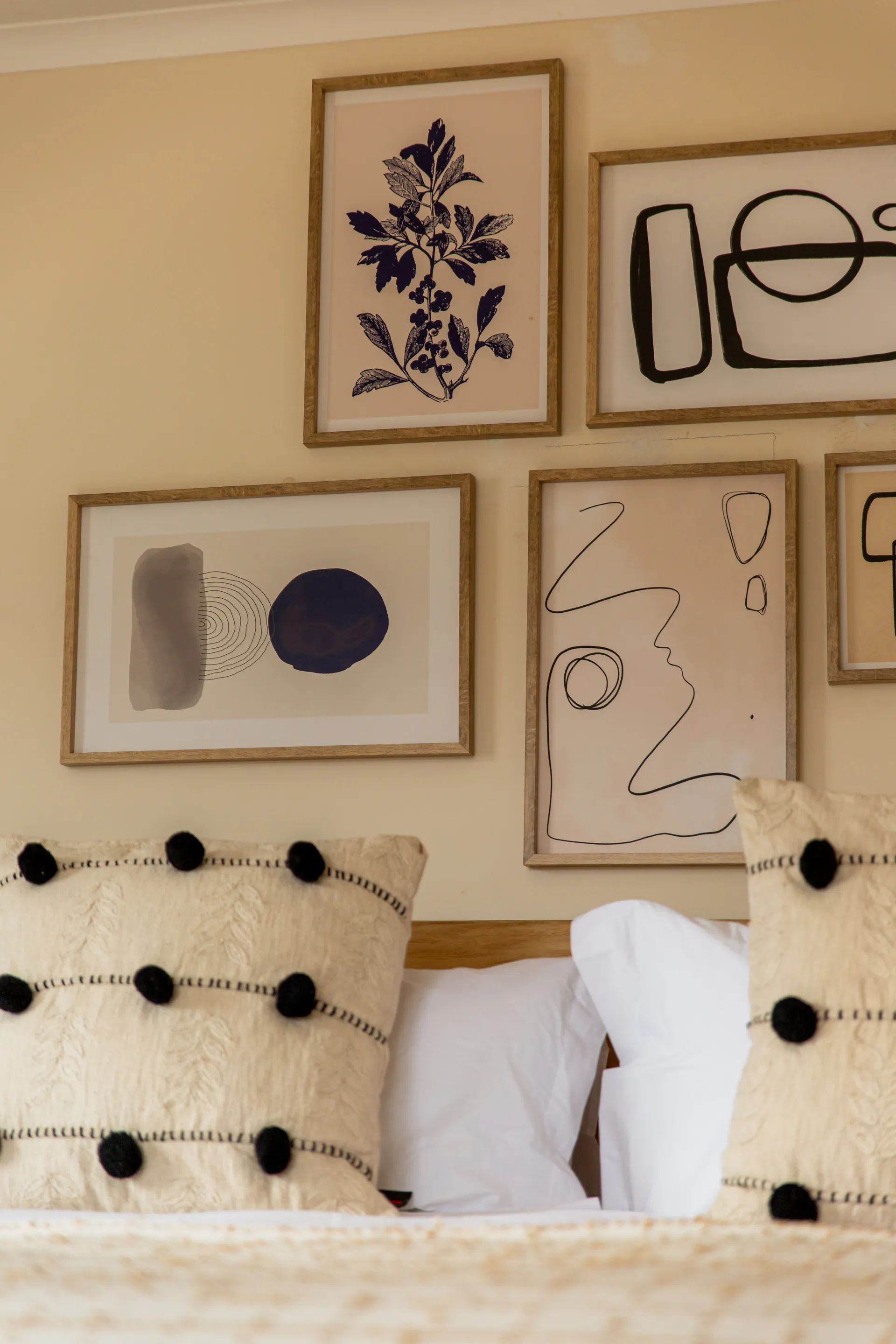 Framed art above the Standard Garden Room headboard