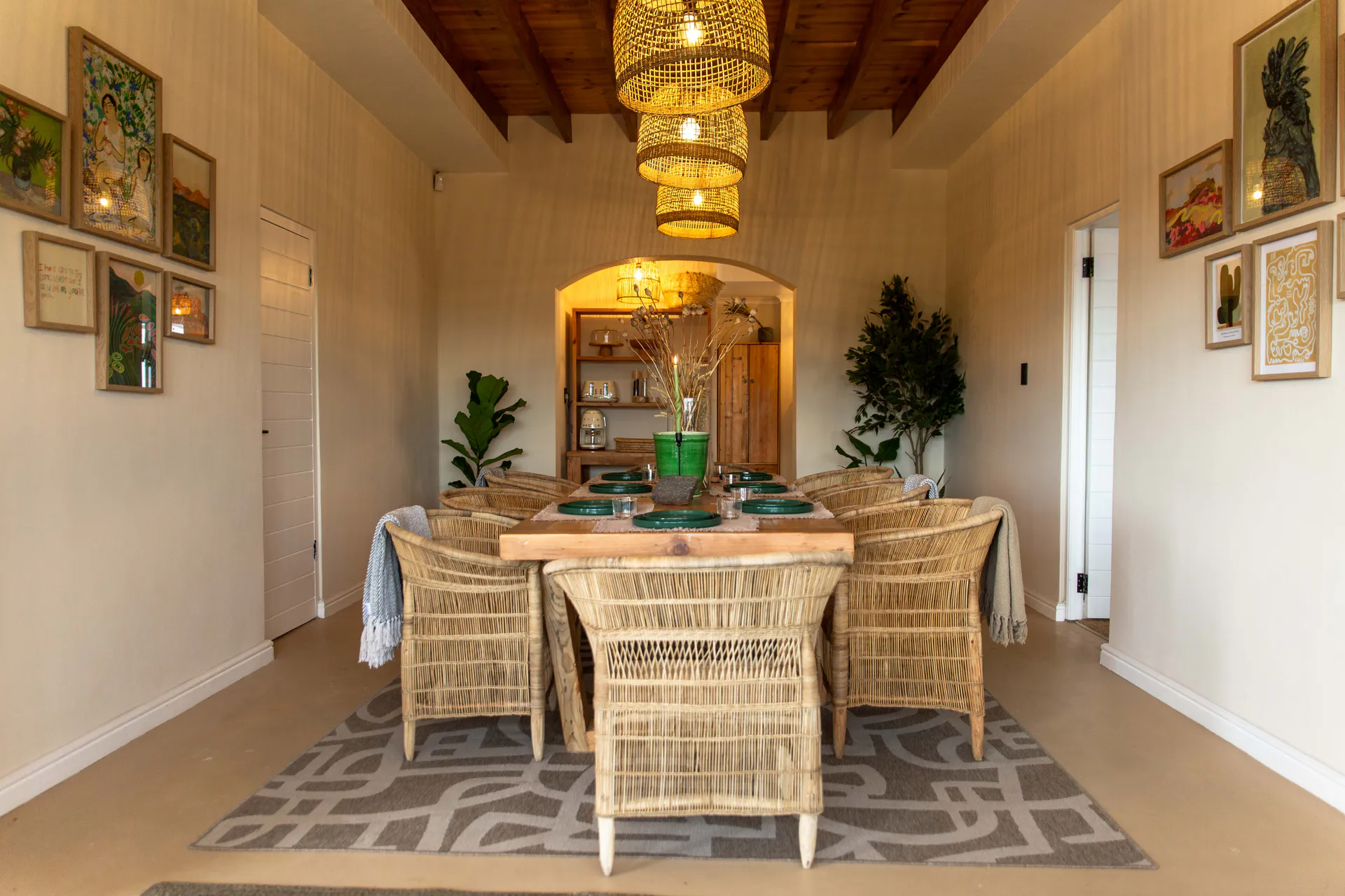Ground Floor Apartment dining table under rattan pendant lights