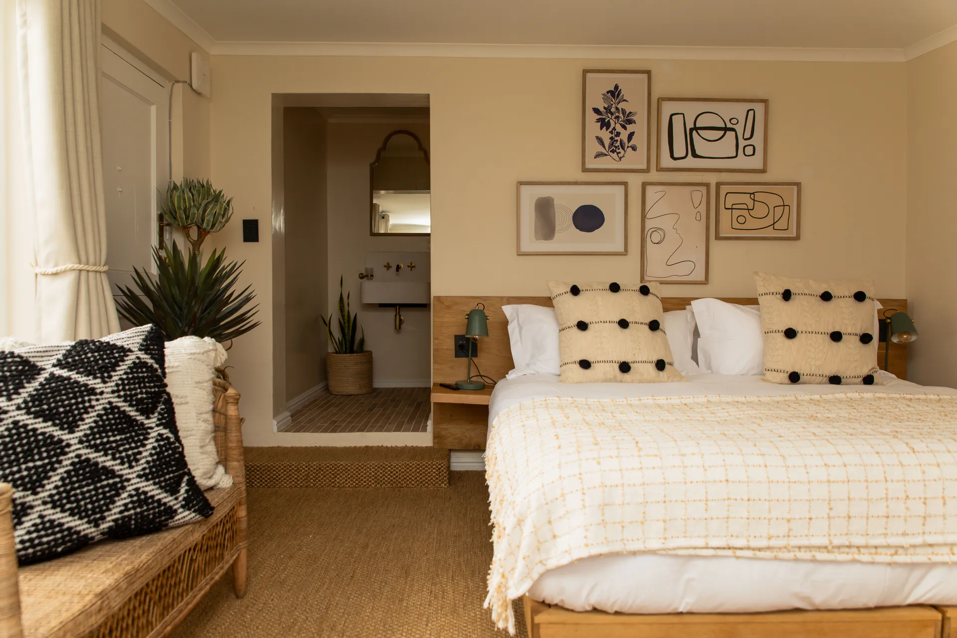 Standard Garden Room bed with the en-suite beyond