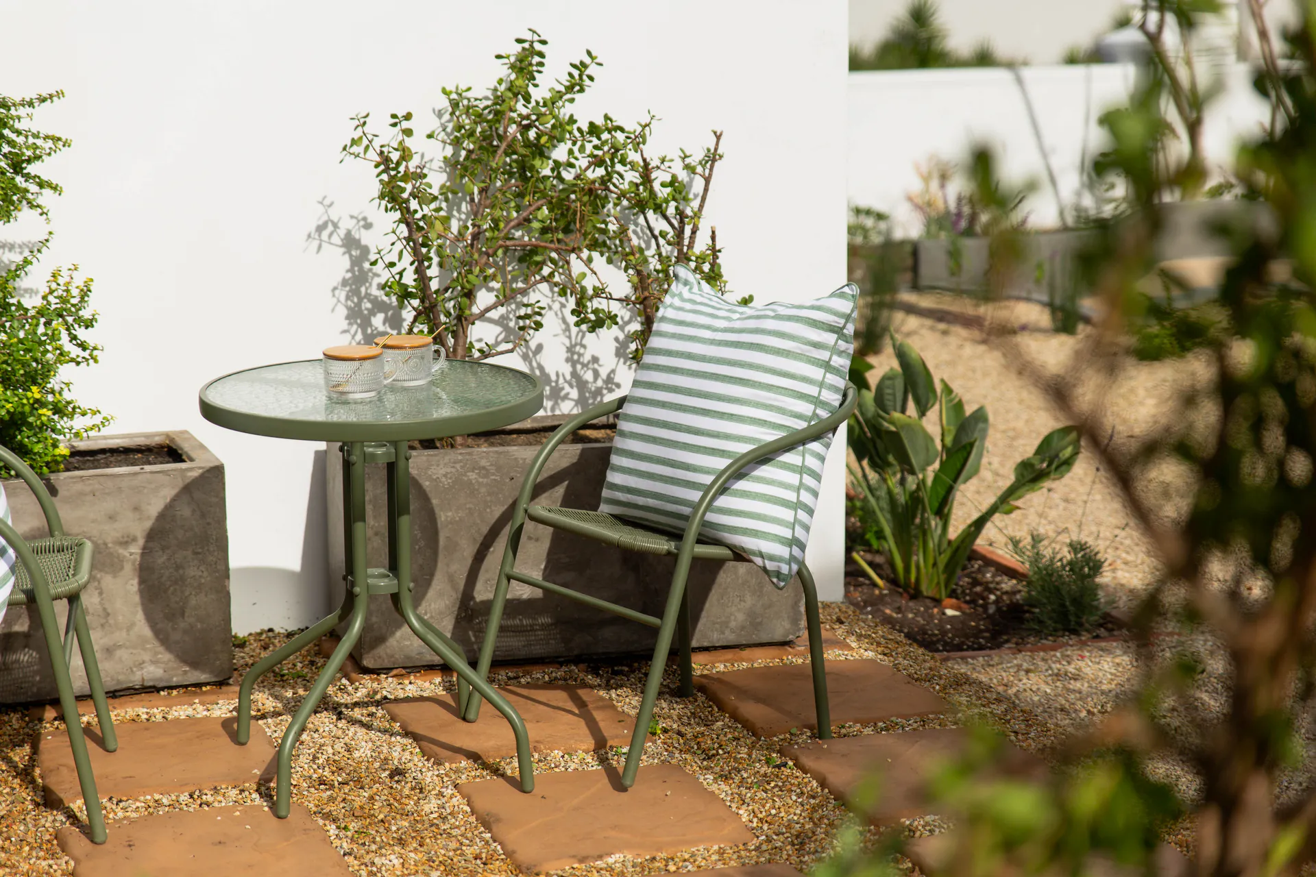 Family Room patio seating with sage-green chairs