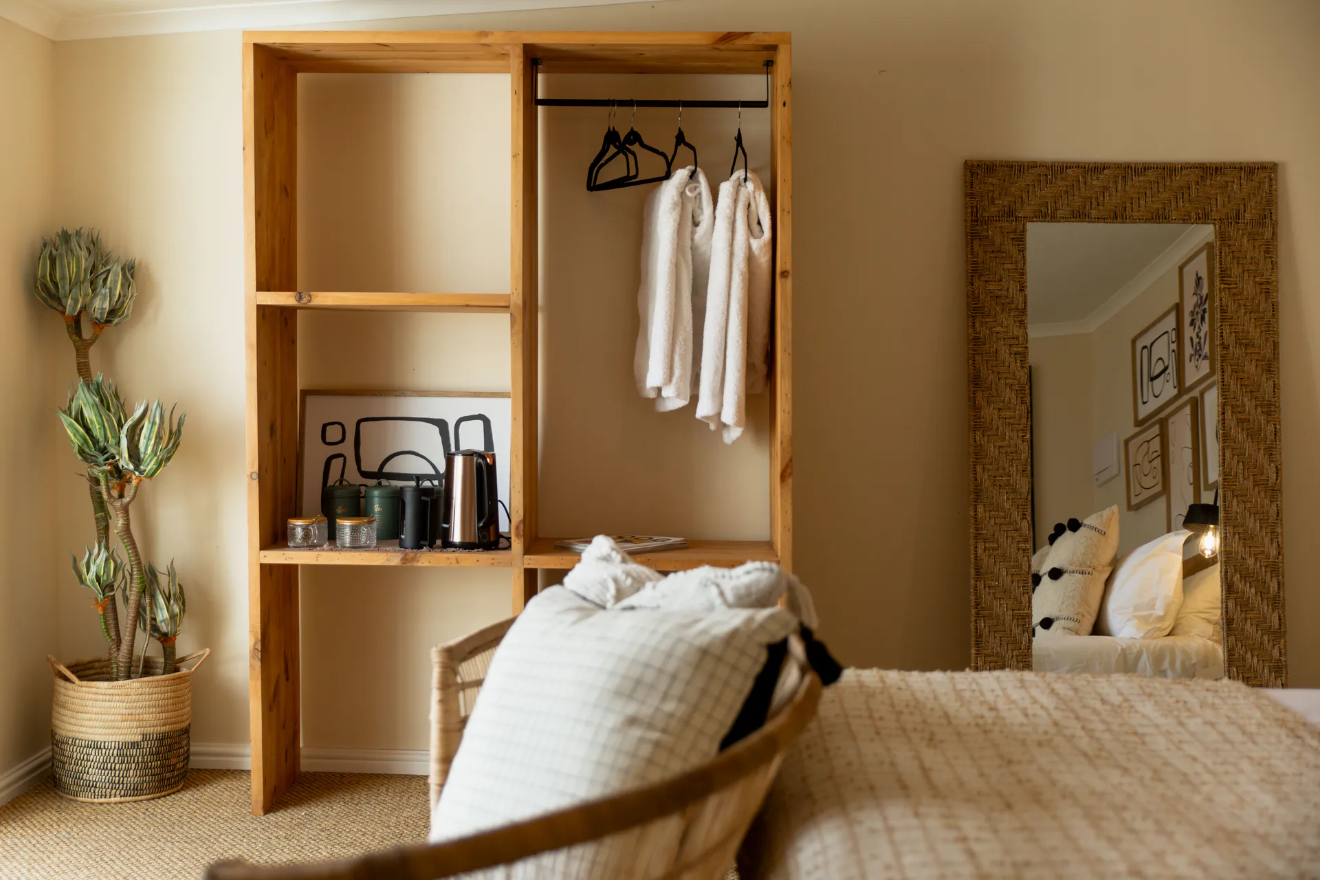 Family Room wardrobe reflected in the rattan mirror