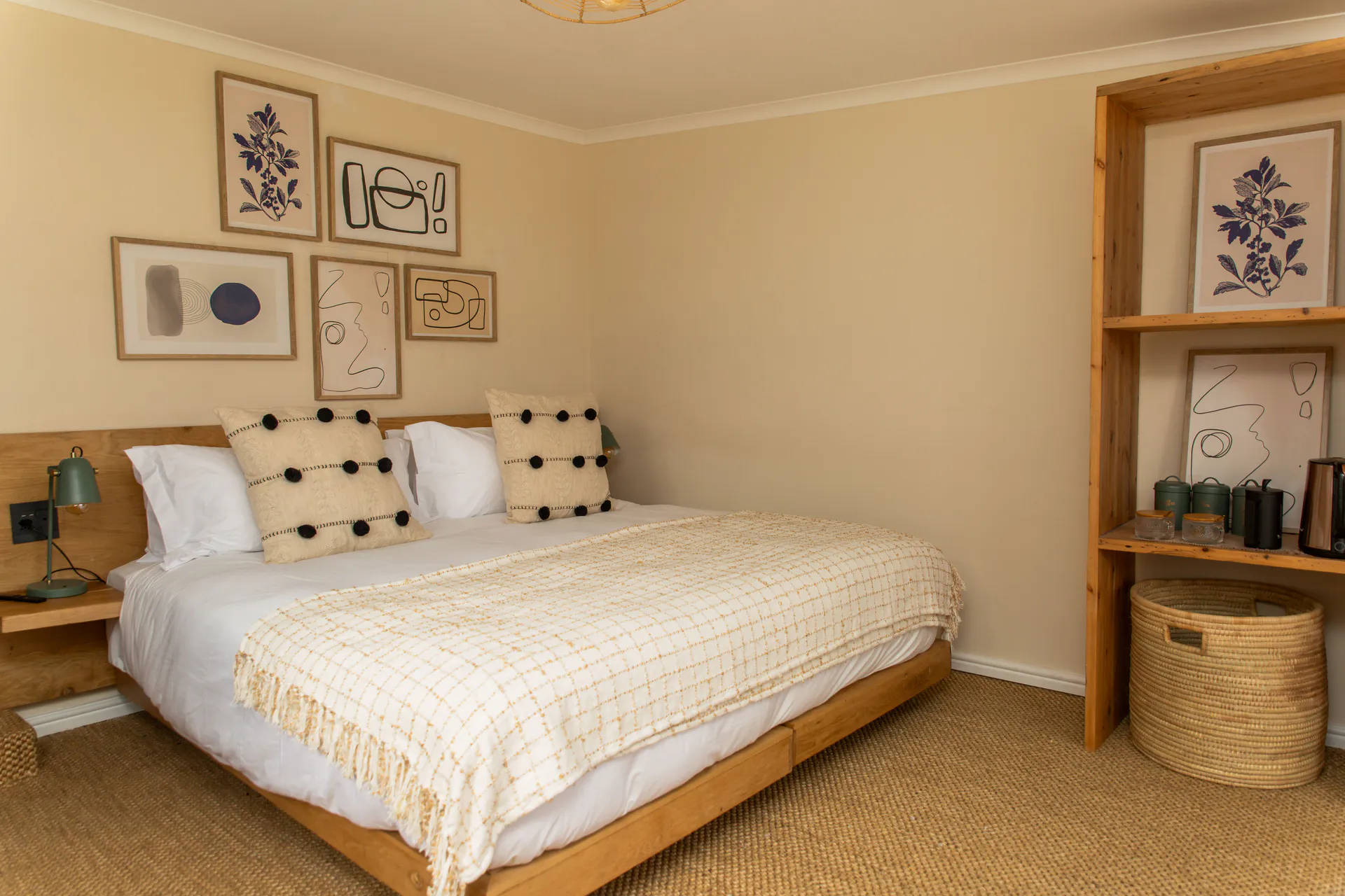 Standard Garden Room bed, gallery wall and open wardrobe