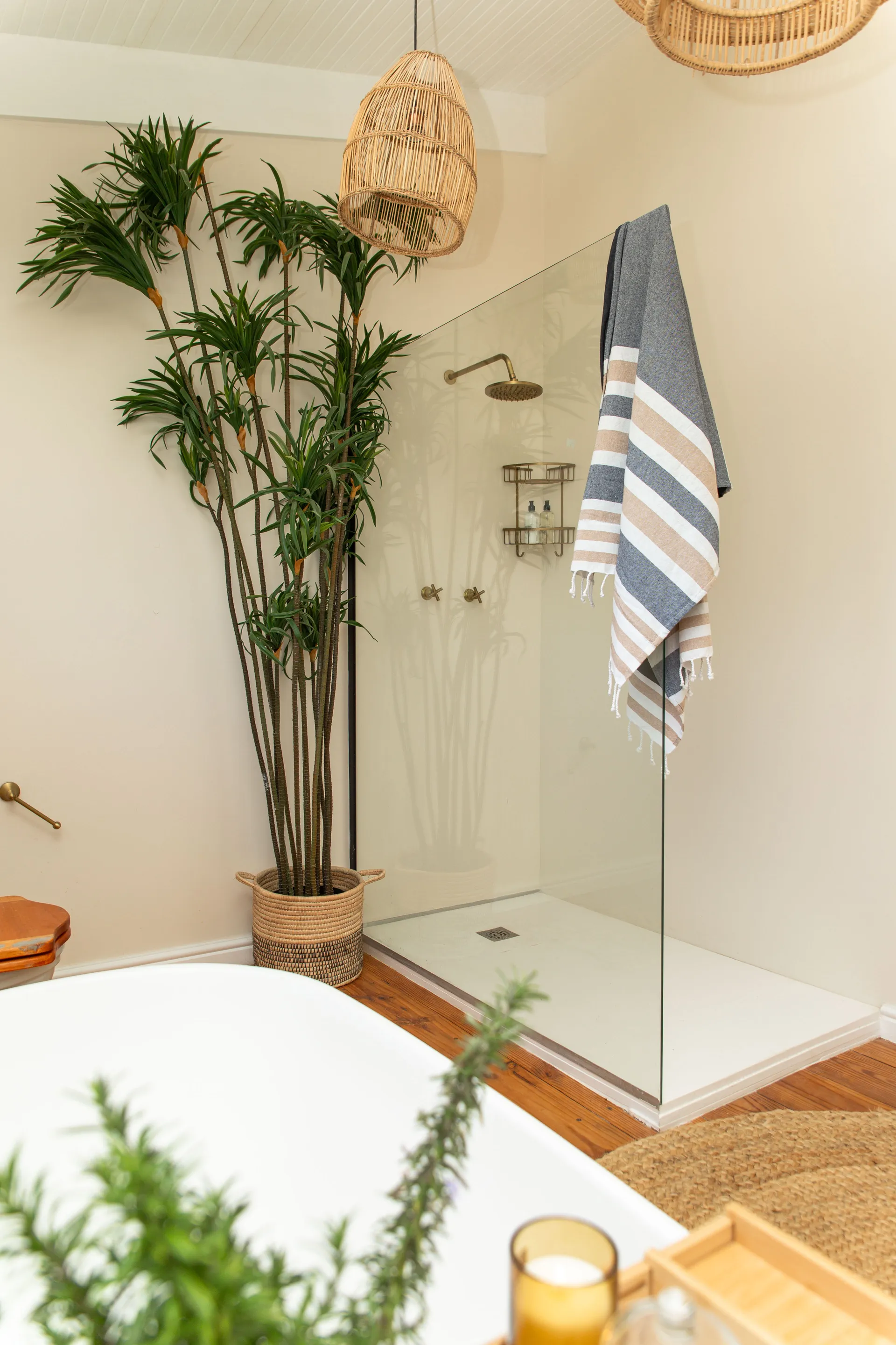 Walk-in shower with brass fittings in the Sea Facing Apartment