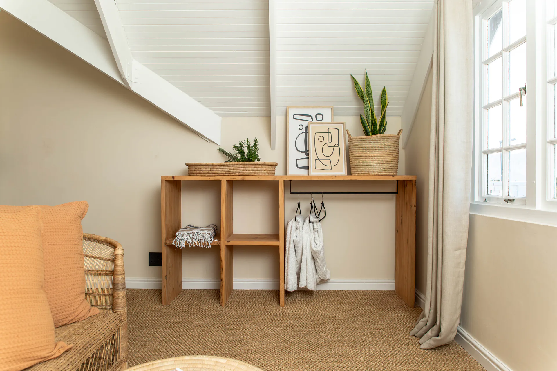 Open wardrobe and robes in the Sea Facing Apartment