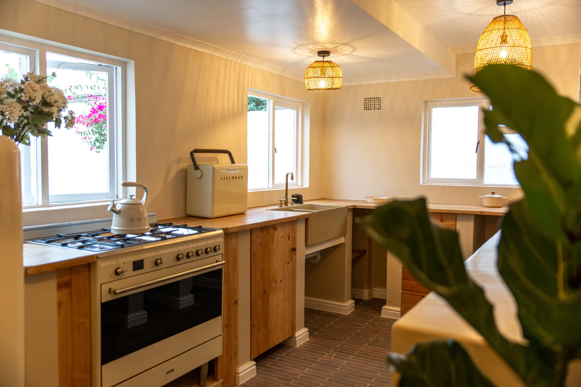 Ground Floor Apartment kitchen with farmhouse sink and rattan lights