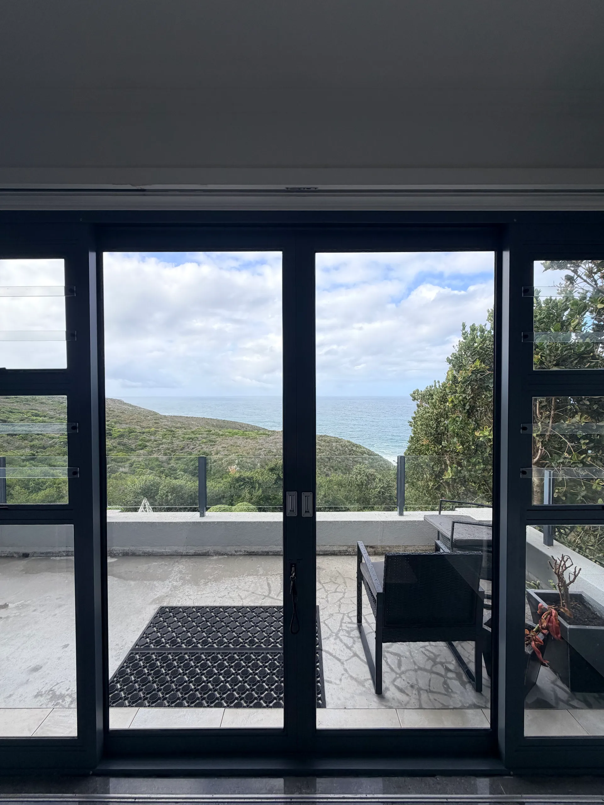 Sea view from Tranquillo through the balcony doors
