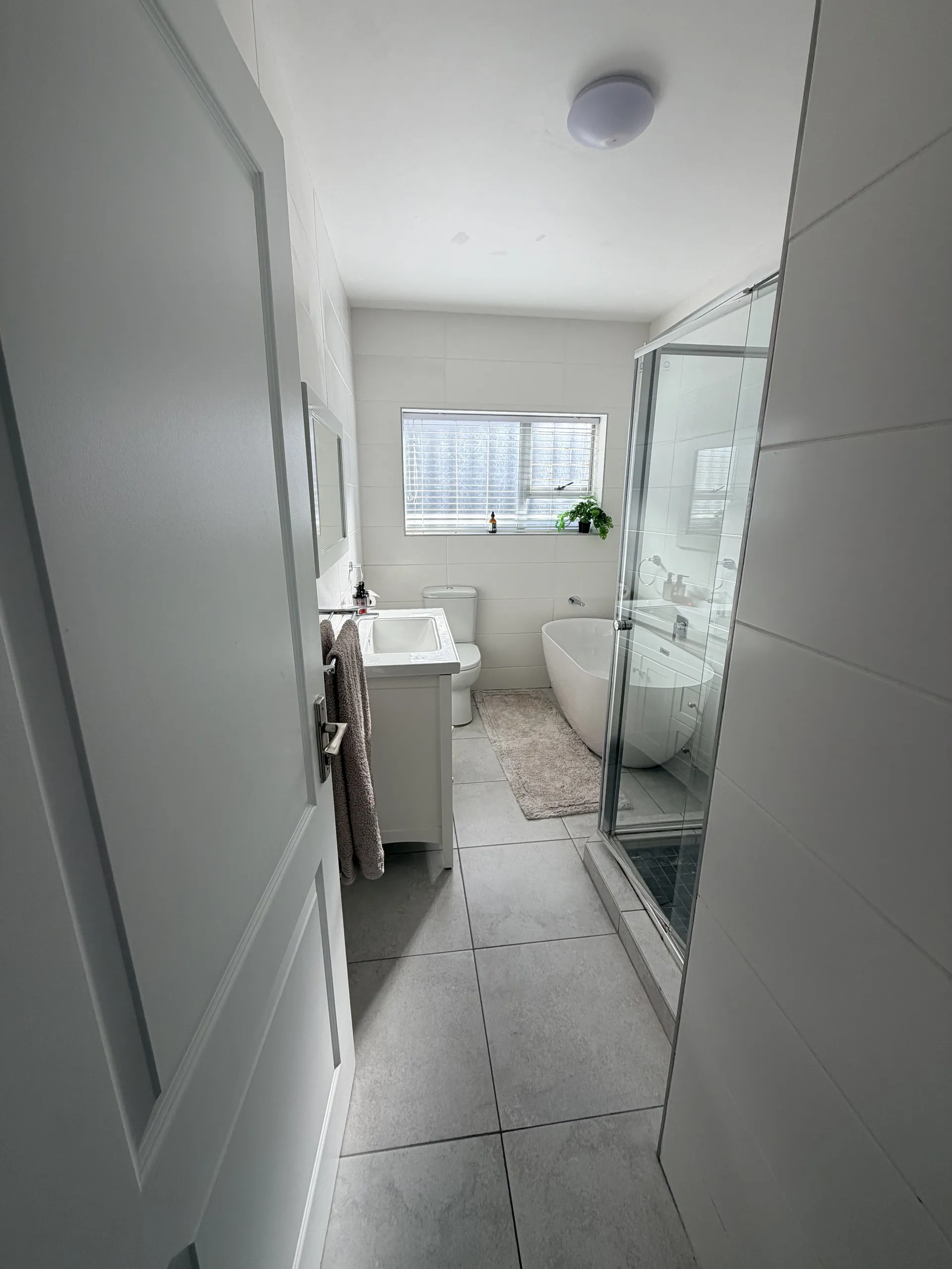 Bathroom with a bath, shower, vanity and toilet